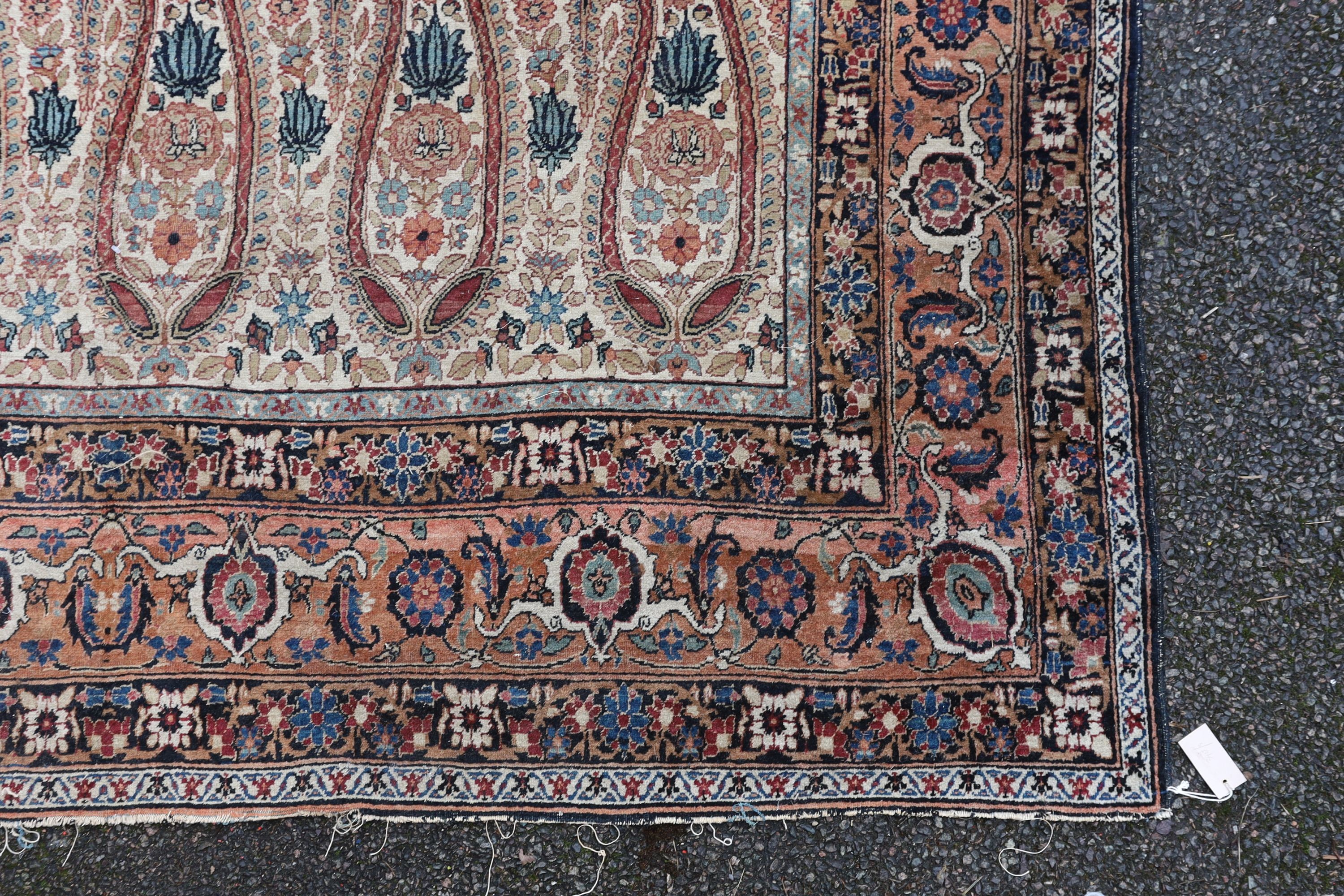 A Kerman rug ivory ground carpet, 360 x 218cm.